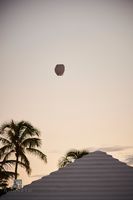 Sky Lantern Above Bermuda Roof