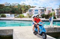 Couple Riding a Scooter
