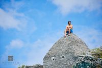 Person on Historic Stone Structure
