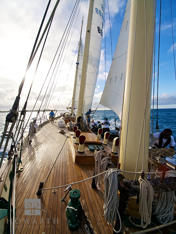 Looking back on the ship with Bermuda in the very distance and the setting sun as the Spirit sail off, north towards Canada