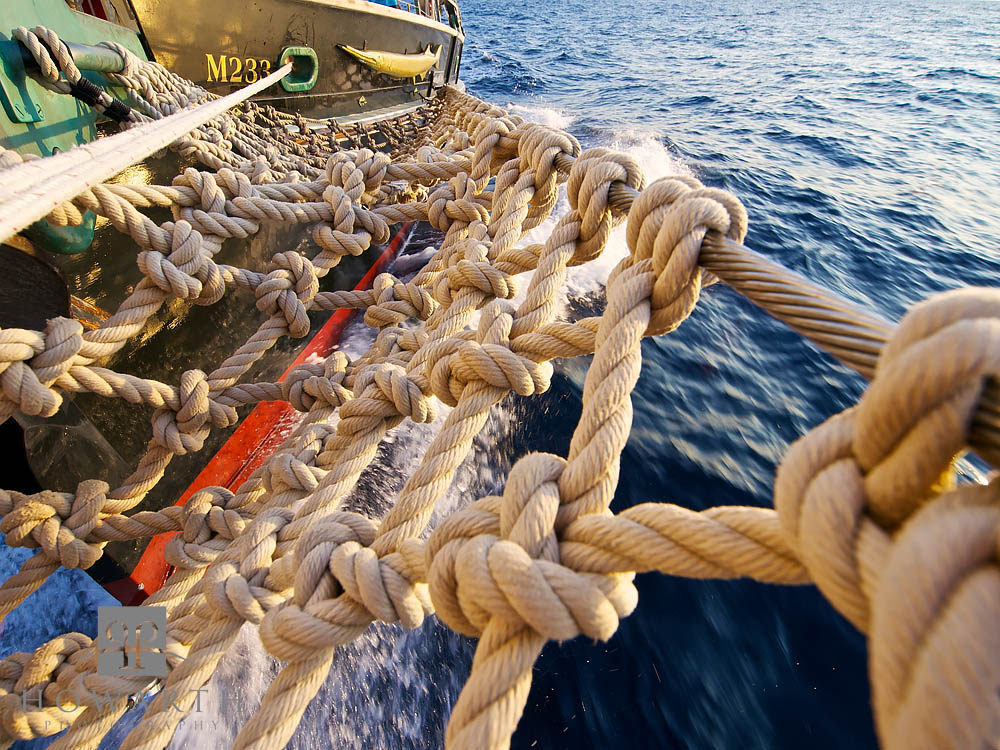 A closeup look at the bow netting back on the ship under sail