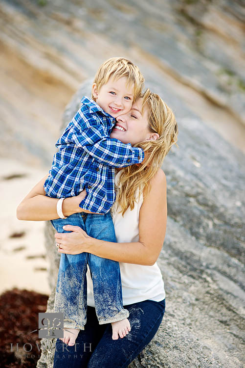 Smiling Mother and Son lovingly hug