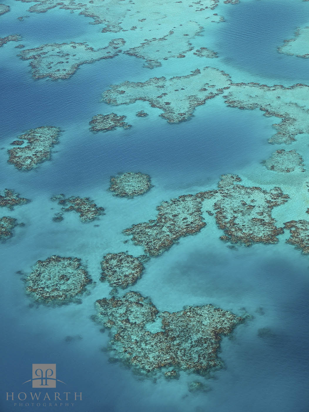 A cluster of reef just off the West side, turquoise waters