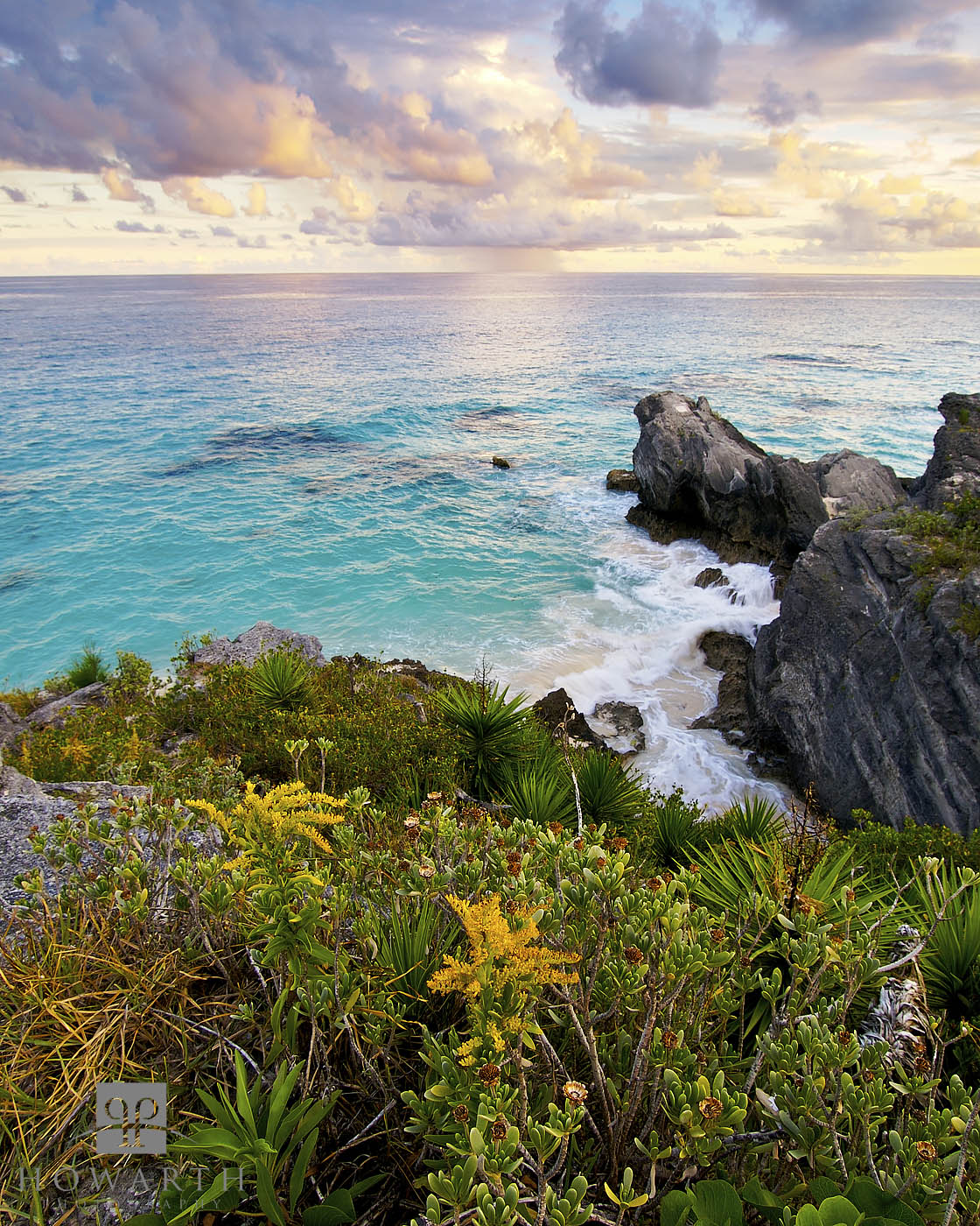 Taken from the cliffs overlooking Chaplin Bay an offshore squall passes by during the evening light