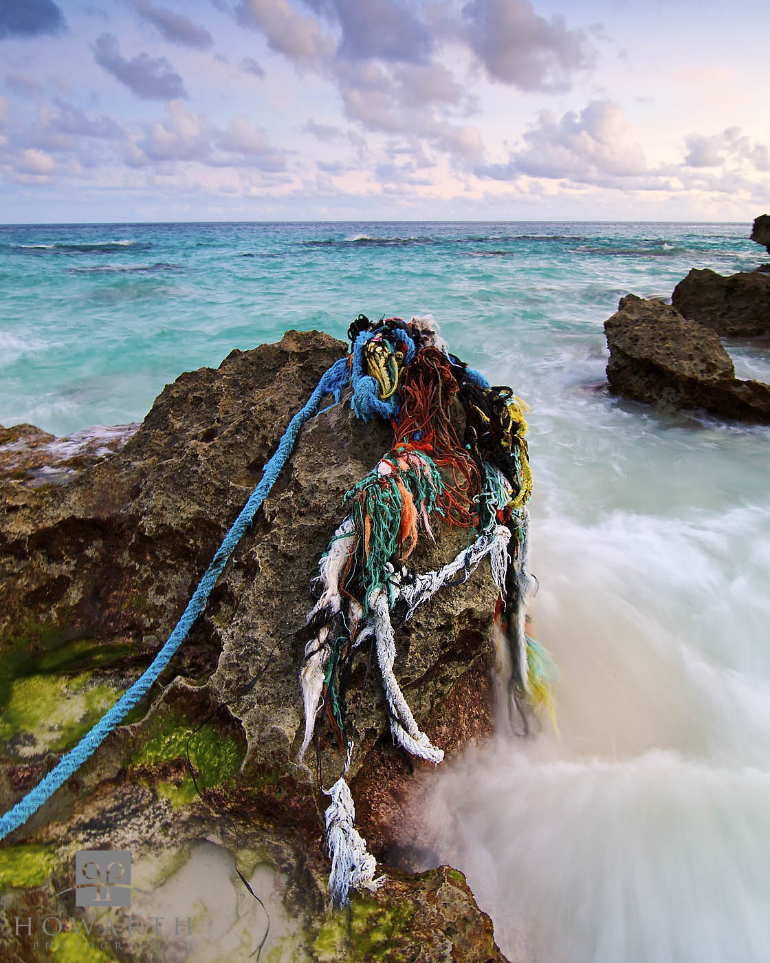Old ropes drape over a rock after being washed ashore